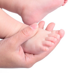 Childs feets in mother hand