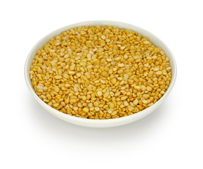 yellow moong dal, skinned and split mung bean  in a small dish