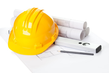 Yellow helmet on house project construction plan