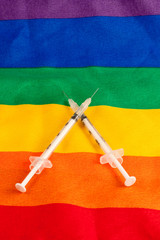 Needles on a rainbow flag