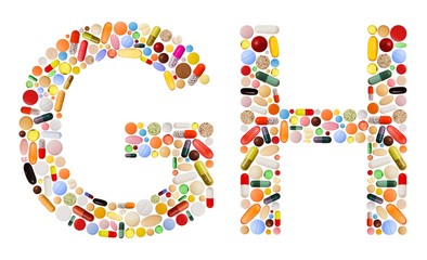 Characters G and H made of colorful pills