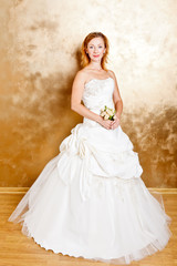 Fototapeta premium Beautiful red haired woman in white bridal dress