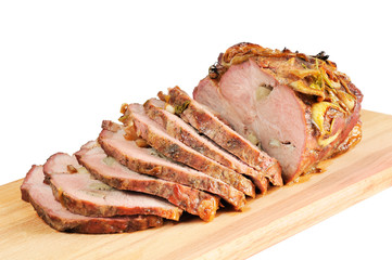 Roast pork on a wooden board