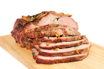 Roast pork on a wooden board