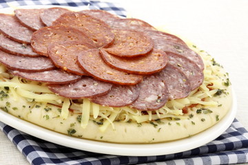 raw salami and pepperoni pizza