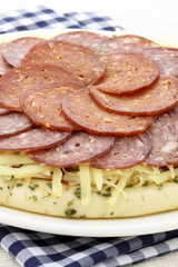 raw salami and pepperoni pizza