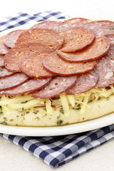 raw salami and pepperoni pizza