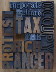 tax the rich words in wood and metal type
