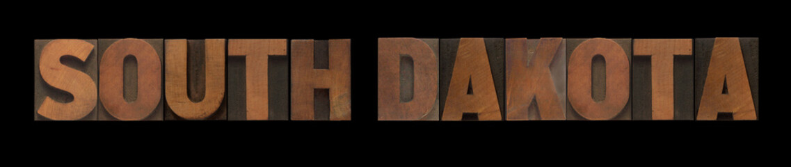 the words South Dakota in old wood type