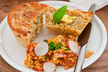 Homemade mediterranean bread with butter scrambled eggs and a le