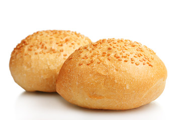 delicious buns with sesame seeds isolated on white