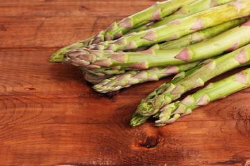 delicious asparagus on wooden background