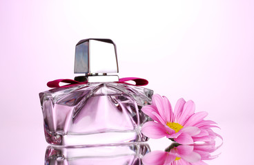 women's perfume in beautiful bottle and flower