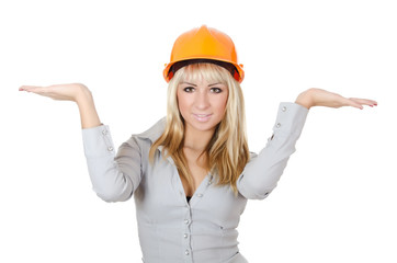 Beautiful girl in a building helmet