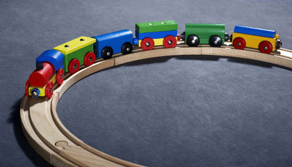 colorful wooden toy train on tracks