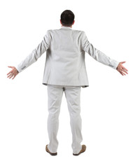 Back view of  thinking young business man in  white suit.
