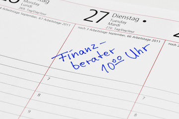 Fototapeta premium Finanzberater Termin im Kalender notiert