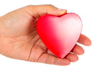 Obraz premium Giving love symbol - female hand holding red heart