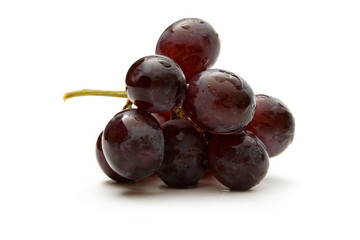 Black grapes isolated on the white background
