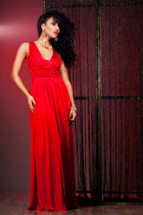 elegant fashionable woman in red dress
