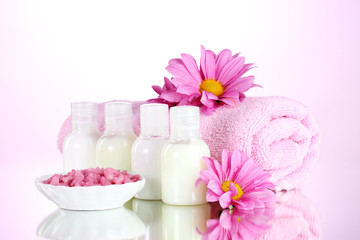 Hotel amenities kit on pink background
