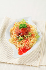 Meat patty and spaghetti