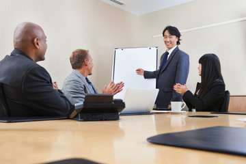 Man giving a presentation to associates
