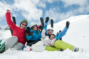 Ski, snow and fun - happy  family  on ski  vacation