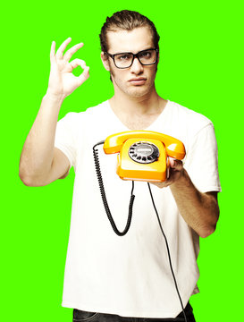 man with telephone over removable chroma key background