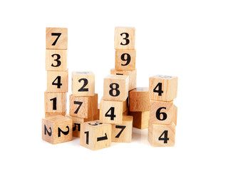 A lot of wooden blocks with numbers over white background