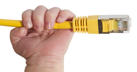 baby holding yellow network plug