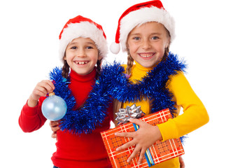 Two smiling girls with Christmas decoration