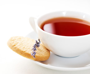 Cup of tea with biscuit and lavender