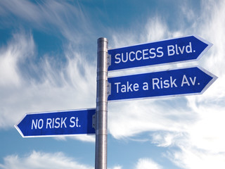 Road Sign success and Risk over a cloudy sky