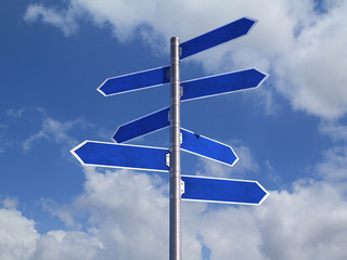 Blue Blank directions Signs over cloudy Sky