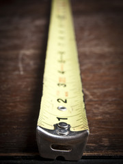 Old tape measure on an old table