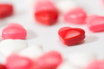 Heart shaped candy amongst others