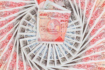 50 pound sterling bank notes closeup view business background