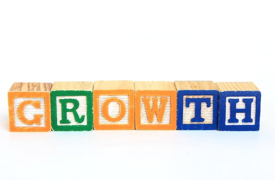 The word growth in alphabet blocks