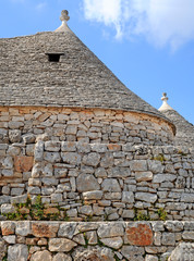 Fototapeta na wymiar Typical conical trulli houses in Alberobello, Italy