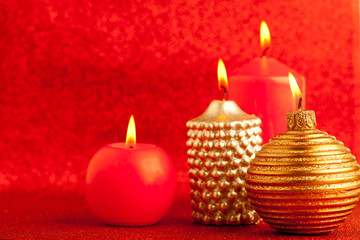 Obraz na płótnie Canvas christmas candles group on red glitter