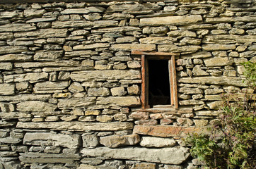 small wood window on a strength wall