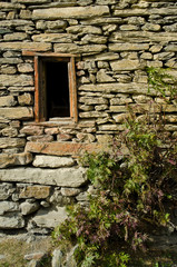 small wood window on a strength wall