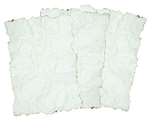 Obraz premium crumpled paper with burnt edges over white