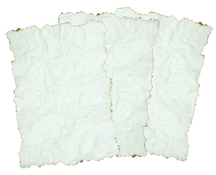 crumpled paper with burnt edges over white