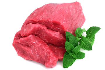 Cut of  beef steak with green leaf. Isolated.