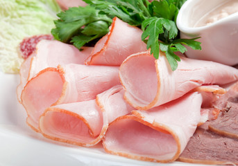 sliced food  meat and sausage arrangement .