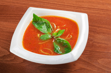 Tomato soup in ceramic bowl