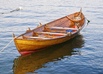 Fototapeta premium The wooden rowing and sailing boat