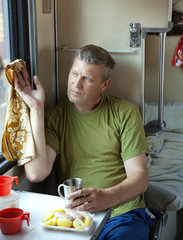Mature man in sleeper train